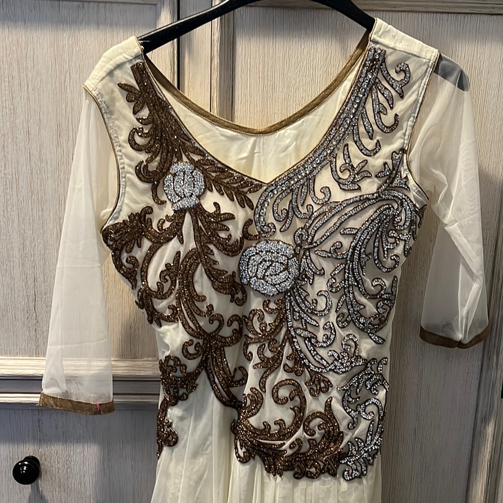 Beautiful net long dress with with and white and gold work